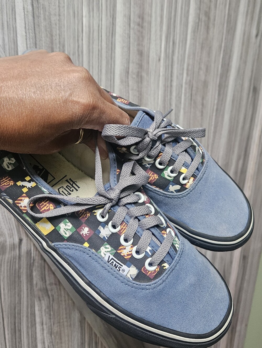 Vans Harry Potter checkerboard house decal shoes featuring a low-top design